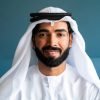 Arab man wearing traditional emirate clothing  working in the office - Middle eastern businessman portrait